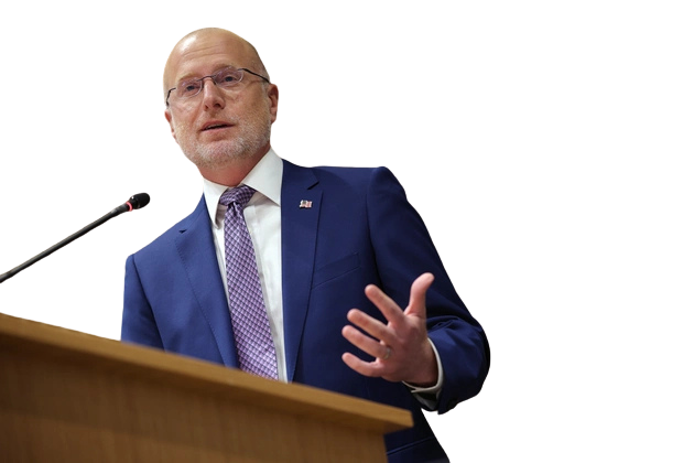 Brendan Carr speaking at a lectern