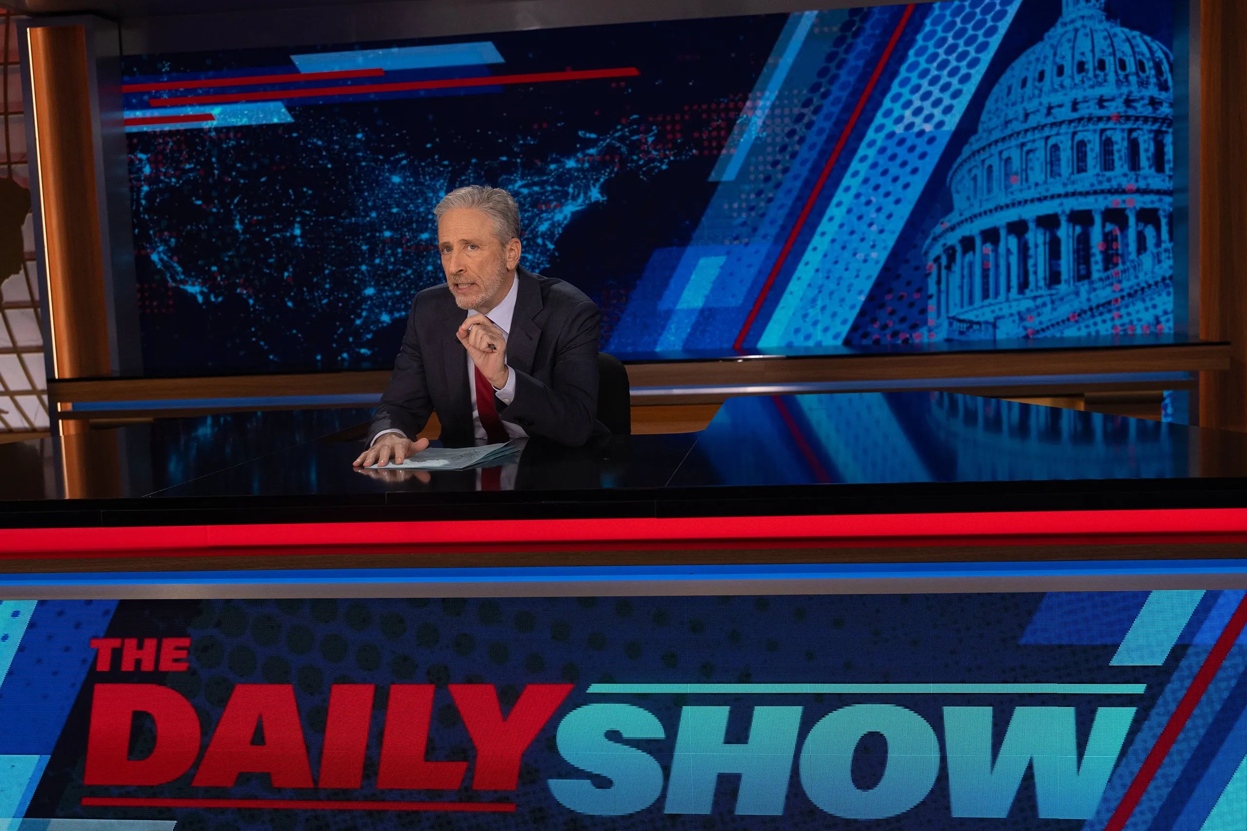 Jon Stewart at The Daily Show desk
