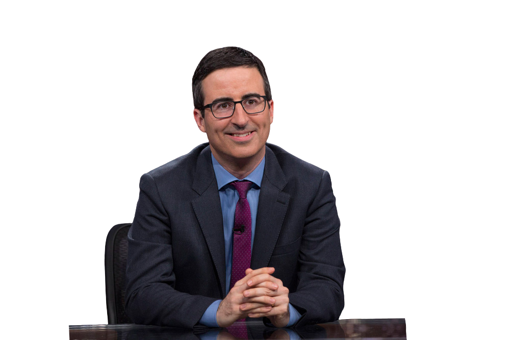 John Oliver seated behind a desk