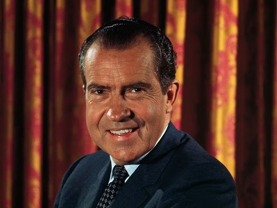 Richard Nixon smiling for a portrait